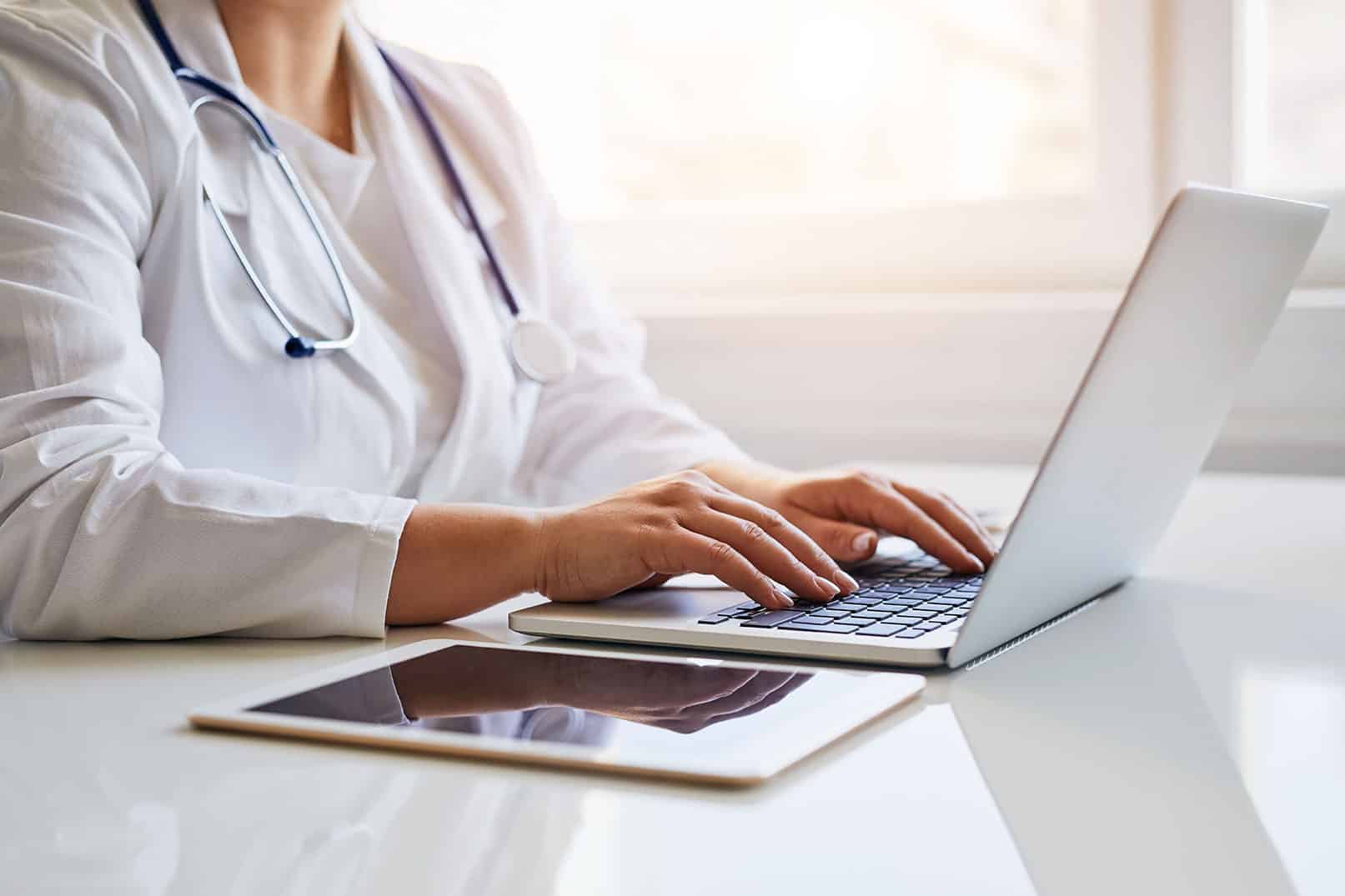 Medical professional using laptop