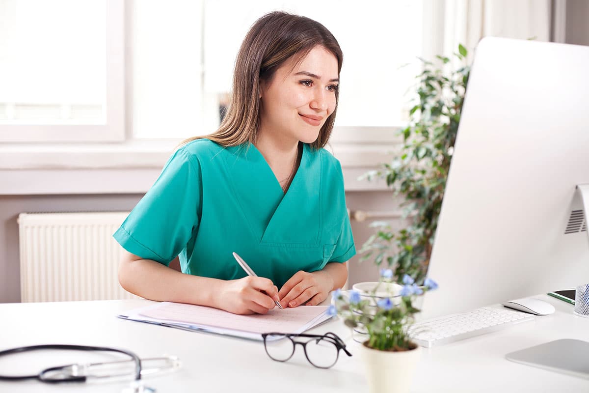 Home care professional using computer in office