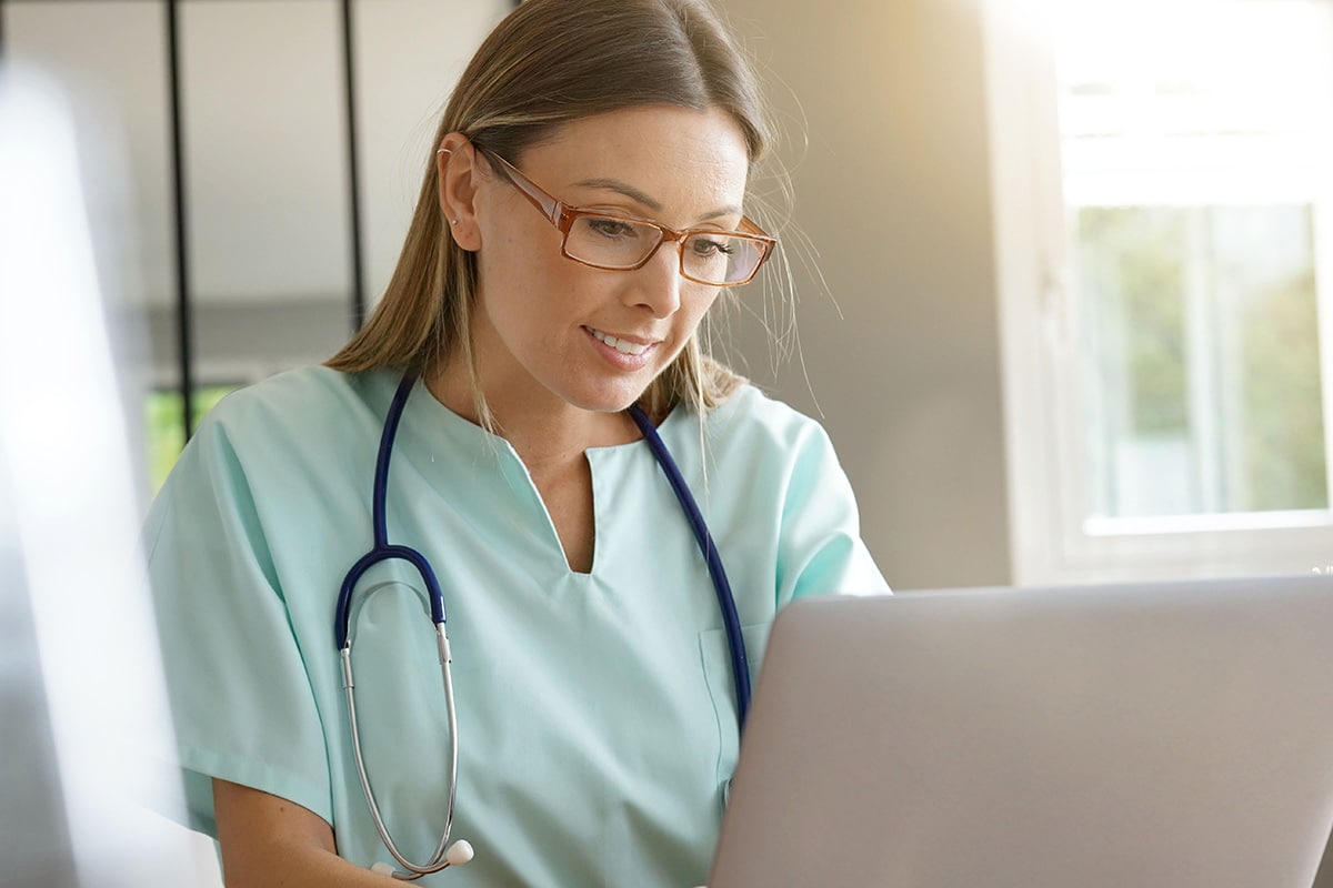 nurse working on laptop computer