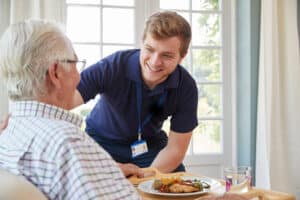 Care giver working with patient.